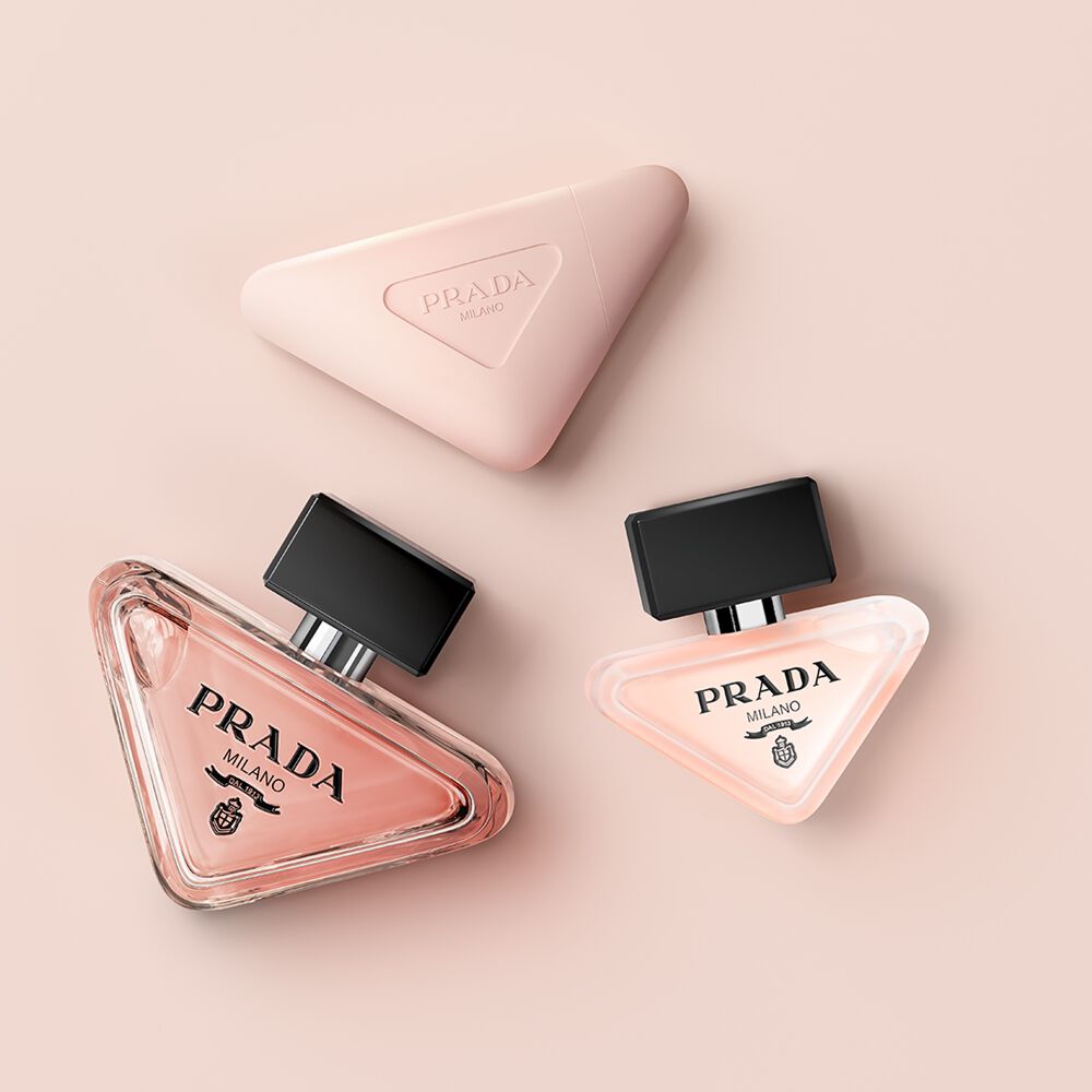 Prada Paradoxe collection with Eau de Parfum, Hair Mist and Hand Cream on a light pink background