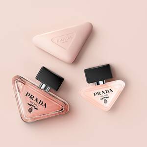 Prada Paradoxe collection with Eau de Parfum, Hair Mist and Hand Cream on a light pink background