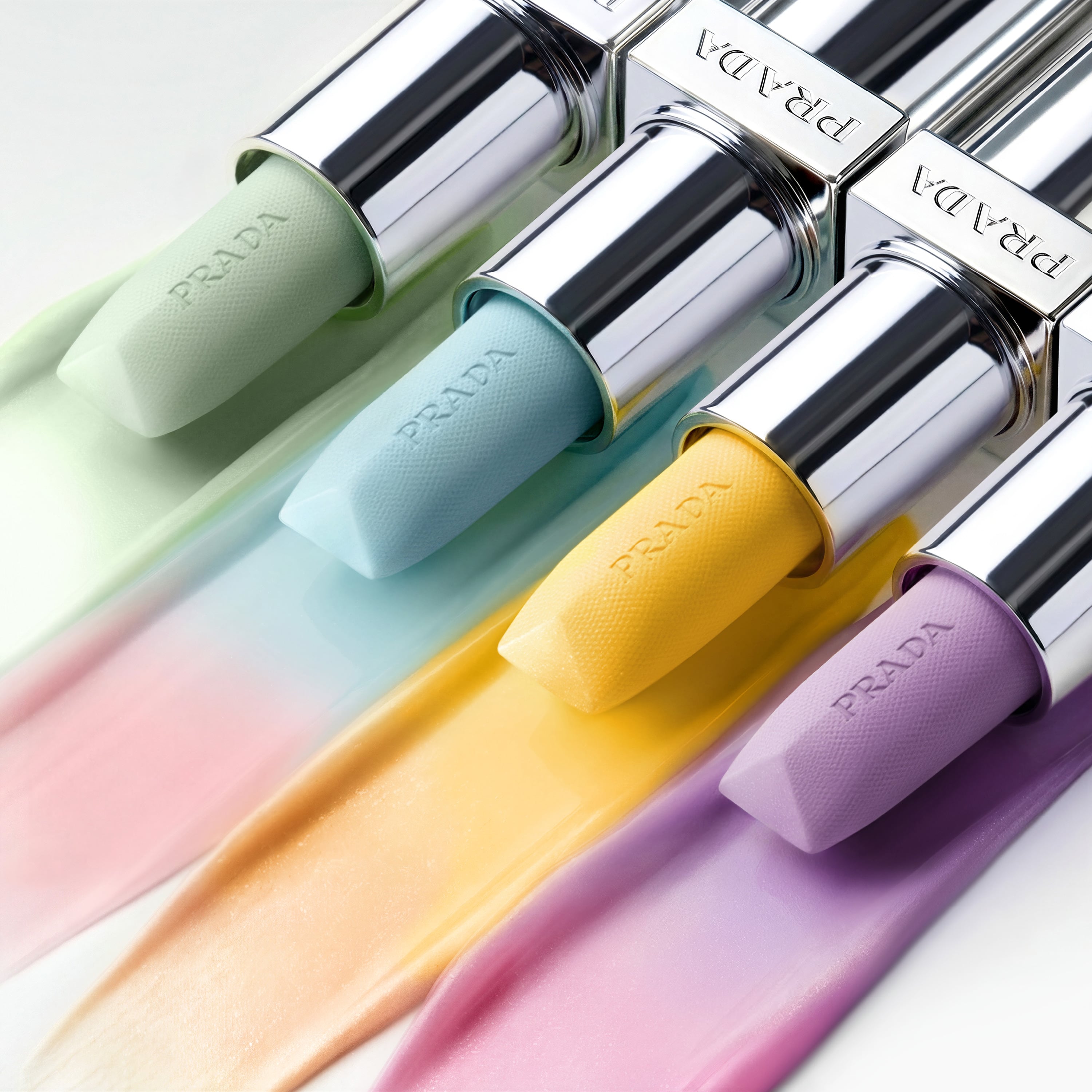 Prada Balm Lip Hydrating Care in shade Astral Pink Refillable Mechanism on a light green background 